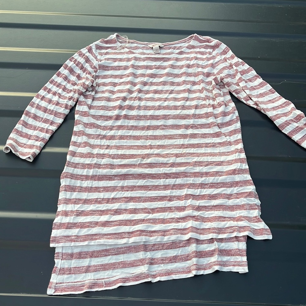 Pink and white top. The front is shorter than the back! Semi-long sleeves!